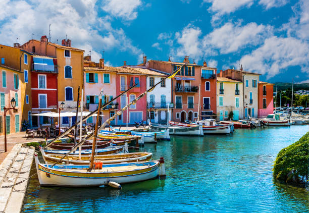 Martigues, France - June 25, 2017: View of the small harbor in the old center of Martigues, a tourist destination with small bars and adjacent restaurants.