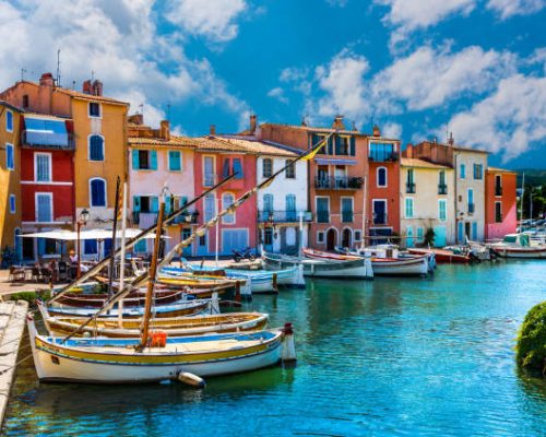 Martigues, France - June 25, 2017: View of the small harbor in the old center of Martigues, a tourist destination with small bars and adjacent restaurants.